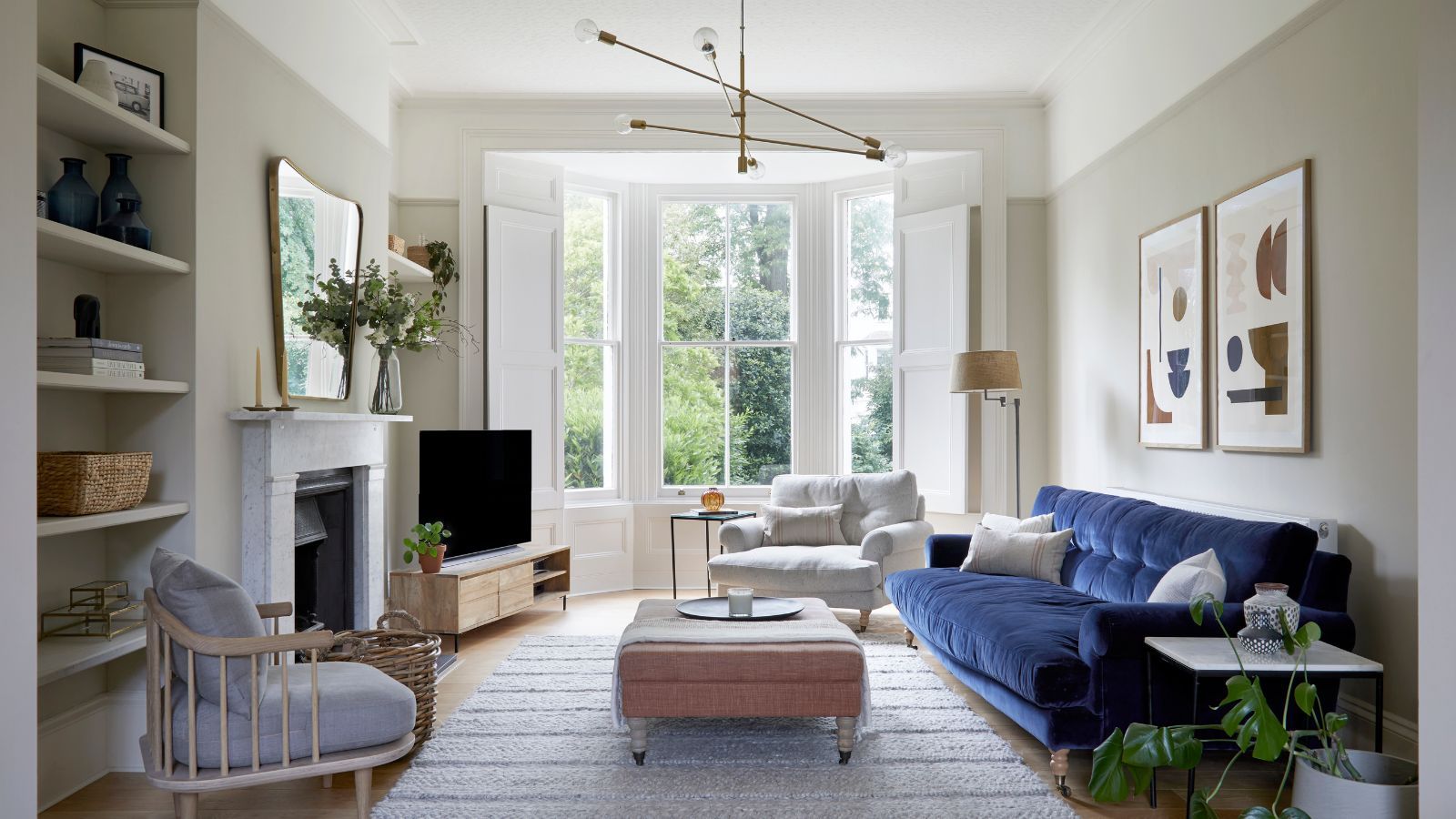 Designers Have 4 Genius Tricks to Make Your TV Disappear in the Living Room