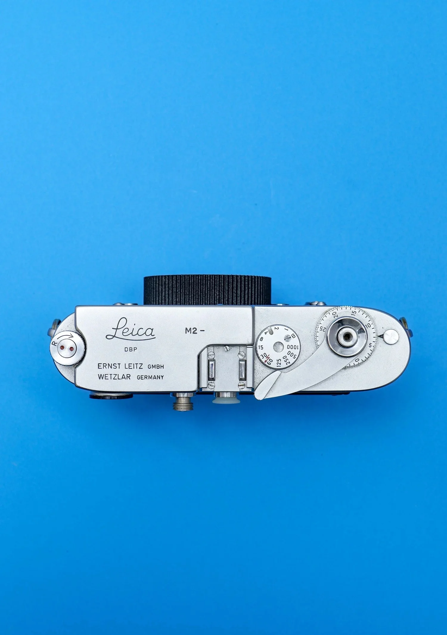 This Clever Leica Lens Cap Hides an AirTag Tracker in Plain Sight