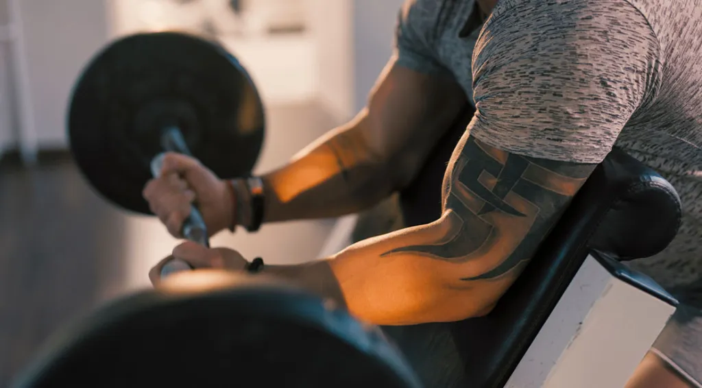 Preacher Curls and Skull Crushers: How to Build Bigger Arms with Isolation Work