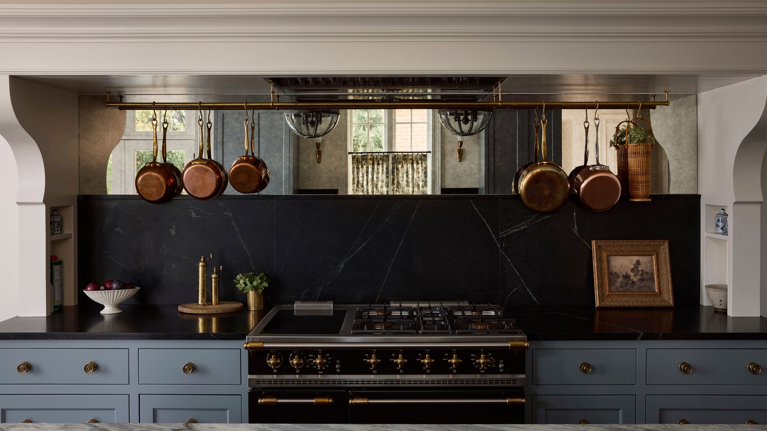 Mirrored Backsplashes Are the Designer Secret for Luxe Small Kitchens