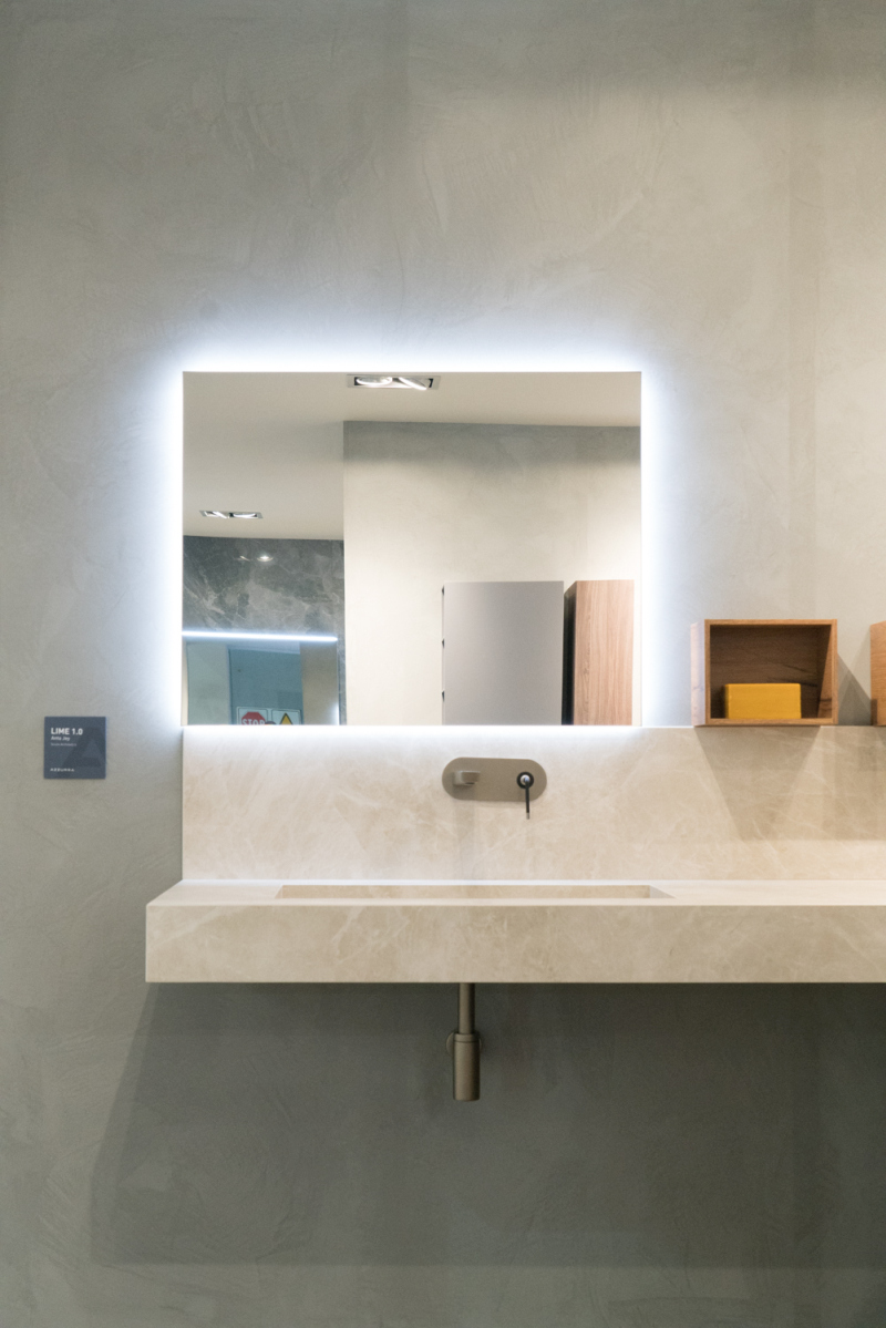Stone Sinks, Lit Mirrors and Half Walls: The New Bathroom Minimalism