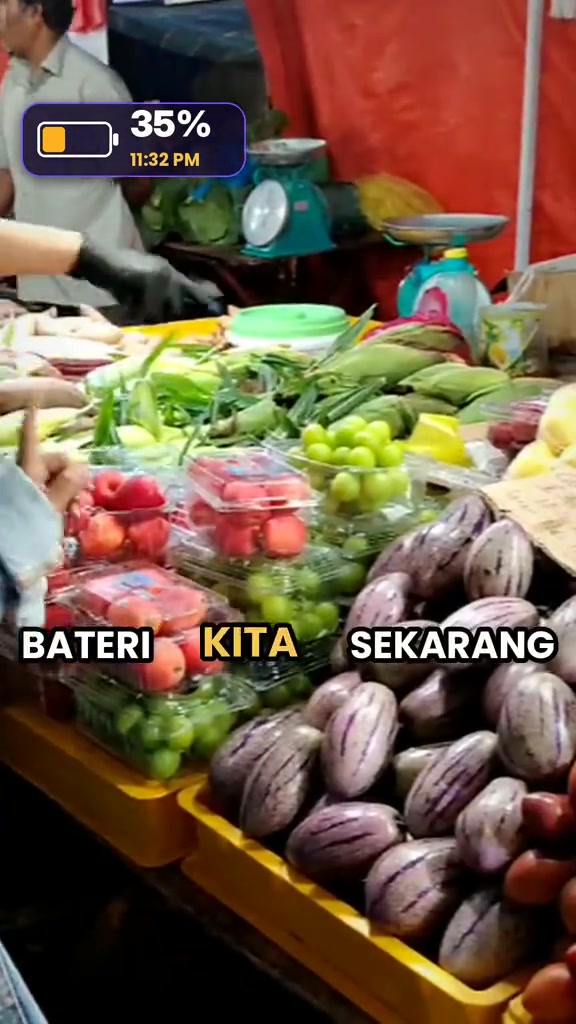 Overlay bateri 35% pukul 11:32 malam di atas rakaman suasana pasar malam semasa ujian lenjan